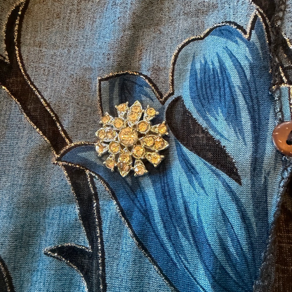 Floral Brooch on Blue Patterned Fabric